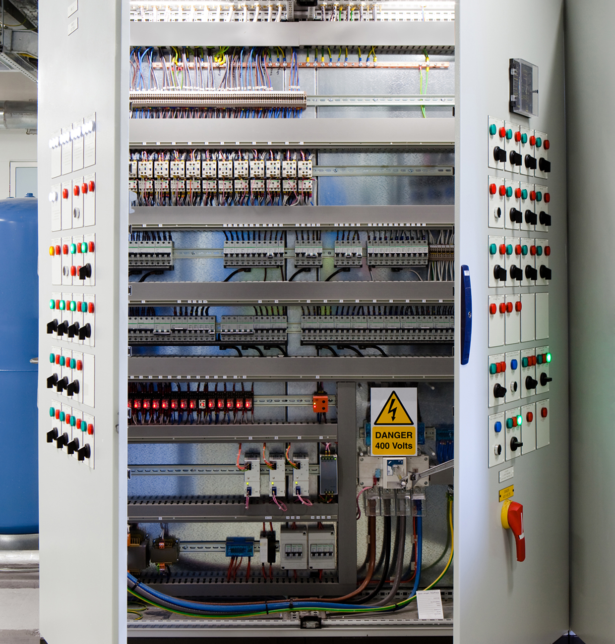 Industrial electrical cabinet with warning sign