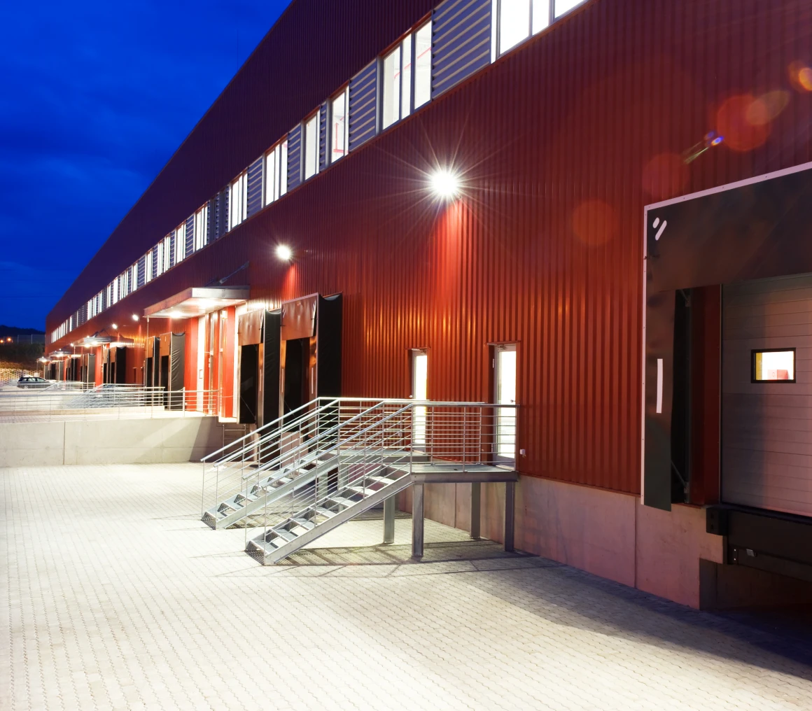 Red warehouse exterior with stairs