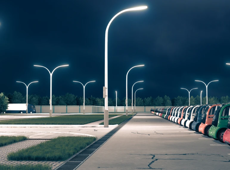 Parking lot with colorful cars at night