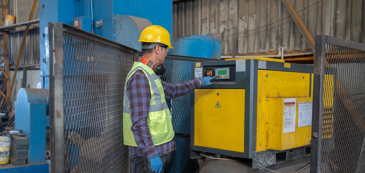 Technician using control panel in warehouse