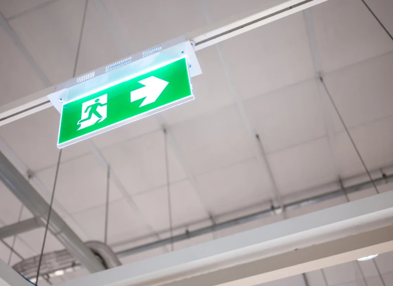 Green exit sign with arrow