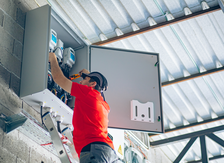 Worker repairing industrial equipment