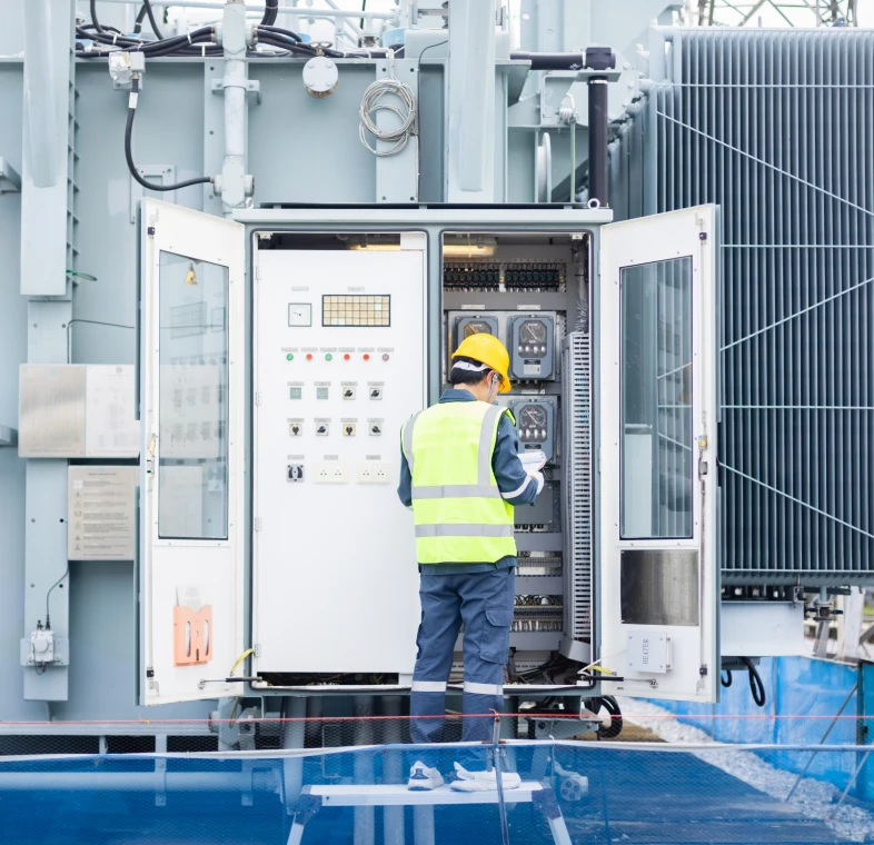Engineer checking equipment in control room